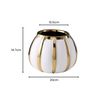 Vase doré et blanc